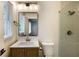 Bathroom features updated fixtures, a glass shower, and a window for natural light at 754 Pinehill Se Dr, Smyrna, GA 30080