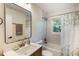 Bathroom with a modern vanity, mirror, and shower-tub combo at 754 Pinehill Se Dr, Smyrna, GA 30080