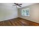 Bright bedroom with hardwood floors, a ceiling fan, and a window at 754 Pinehill Se Dr, Smyrna, GA 30080