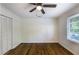 Bedroom with hardwood floors and closet and features a window for natural light at 754 Pinehill Se Dr, Smyrna, GA 30080