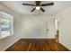 Bright bedroom features hardwood floors, a ceiling fan, and a window for natural light at 754 Pinehill Se Dr, Smyrna, GA 30080