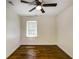 Bedroom features hardwood floors, a ceiling fan, and a window for natural light at 754 Pinehill Se Dr, Smyrna, GA 30080