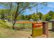 Sign for Cobb Park in Smyrna, GA, with a view of the park's baseball field and playground equipment at 754 Pinehill Se Dr, Smyrna, GA 30080
