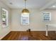 Dining room with hardwood floors and a modern pendant light at 754 Pinehill Se Dr, Smyrna, GA 30080