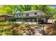 Back exterior of home with a sunroom and attached carport at 754 Pinehill Se Dr, Smyrna, GA 30080