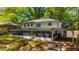 Back exterior of home with a sunroom and attached carport at 754 Pinehill Se Dr, Smyrna, GA 30080