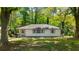 Charming single-story home with a well-maintained front lawn and mature trees at 754 Pinehill Se Dr, Smyrna, GA 30080