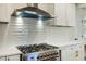 Modern kitchen featuring stainless steel appliances, white cabinets, and sleek countertops at 754 Pinehill Se Dr, Smyrna, GA 30080