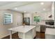Bright, renovated kitchen with an island, stainless steel appliances, and crisp white cabinetry at 754 Pinehill Se Dr, Smyrna, GA 30080