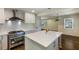 Bright and open kitchen with a large island, stainless steel appliances, and hardwood floors at 754 Pinehill Se Dr, Smyrna, GA 30080