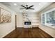 Living room featuring hardwood floors, a fireplace, and built-in shelves at 754 Pinehill Se Dr, Smyrna, GA 30080