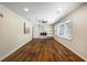 Open living room with hardwood floors, modern fireplace, built-ins, and bright windows at 754 Pinehill Se Dr, Smyrna, GA 30080