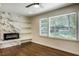Spacious living room with fireplace, built-in shelving, and large windows at 754 Pinehill Se Dr, Smyrna, GA 30080