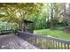 Well-maintained backyard with gazebo and lush landscaping offers a private retreat at 1763 Hearthstone Cir, Lawrenceville, GA 30043