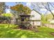House boasts a lush backyard featuring a cozy gazebo and green lawn at 1763 Hearthstone Cir, Lawrenceville, GA 30043