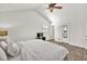 Bright bedroom features a queen bed, ceiling fan, and ensuite bathroom at 1763 Hearthstone Cir, Lawrenceville, GA 30043