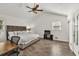 Bright Primary bedroom featuring high ceilings, a king-size bed, and ample natural light at 1763 Hearthstone Cir, Lawrenceville, GA 30043