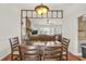 Inviting dining room open to the living room, with wooden table and chairs at 1763 Hearthstone Cir, Lawrenceville, GA 30043