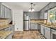 Well-equipped kitchen with granite countertops, stainless steel appliances, and ample cabinetry at 1763 Hearthstone Cir, Lawrenceville, GA 30043