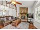 Inviting living room with stone fireplace, and open to a sunny dining space at 1763 Hearthstone Cir, Lawrenceville, GA 30043