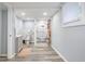 Bright bathroom featuring gray wood floors, a tiled shower, and a modern vanity at 2162 Doris Dr, Decatur, GA 30034