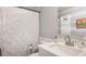Small bathroom features a white vanity, modern fixtures and a patterned shower curtain at 2162 Doris Dr, Decatur, GA 30034