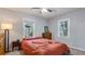 Cozy bedroom with neutral colors, windows for natural light, and hardwood furniture at 2162 Doris Dr, Decatur, GA 30034