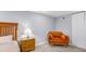 Cozy bedroom features a bed and a velvet chair for relaxing at 2162 Doris Dr, Decatur, GA 30034