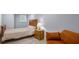 Cozy bedroom features a bed and a velvet couch for relaxing at 2162 Doris Dr, Decatur, GA 30034