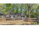Charming single-story home with a fenced yard and mature trees offering both curb appeal and privacy at 2162 Doris Dr, Decatur, GA 30034