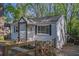 Charming home with a fenced yard, a covered entryway, and lush surroundings, blending comfort with nature at 2162 Doris Dr, Decatur, GA 30034