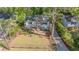 A lovely single story home with a fenced yard and mature trees surrounding the property at 2162 Doris Dr, Decatur, GA 30034