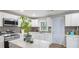 Bright kitchen featuring white cabinets, modern appliances, and a gray tiled backsplash at 2162 Doris Dr, Decatur, GA 30034