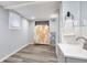 A functional laundry area features a sink, folding rack, and access to storage at 2162 Doris Dr, Decatur, GA 30034