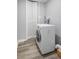 A laundry room with a modern washing machine and bi-fold closet at 2162 Doris Dr, Decatur, GA 30034