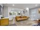 Open living room view into updated kitchen with stainless appliances and hardwood floors at 2162 Doris Dr, Decatur, GA 30034