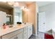 Modern bathroom featuring double sinks, granite countertops, and sleek fixtures at 2316 Hastings Manor Ln, Hampton, GA 30228