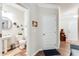 Hallway with a half-bath, light walls, and hardwood floors at 2316 Hastings Manor Ln, Hampton, GA 30228