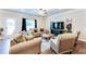 Comfortable living room featuring stylish furnishings and lots of natural light at 2316 Hastings Manor Ln, Hampton, GA 30228