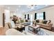 Open-concept living room with a modern kitchen and dining area at 2316 Hastings Manor Ln, Hampton, GA 30228