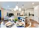 Open-concept living area showcases a kitchen, dining space, and comfortable seating at 2316 Hastings Manor Ln, Hampton, GA 30228