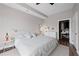 Neutral bedroom with hardwood floors features walk-in closet and a table with modern lamp at 325 E Paces Ferry Ne Rd # 312, Atlanta, GA 30305