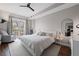 Bright bedroom with hardwood floors, large bed, and balcony access through glass doors at 325 E Paces Ferry Ne Rd # 312, Atlanta, GA 30305