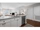 Modern kitchen island featuring granite countertops, stainless steel appliances, and views of the living area at 325 E Paces Ferry Ne Rd # 312, Atlanta, GA 30305