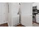 A conveniently located laundry room includes stacked washer and dryer appliances at 325 E Paces Ferry Ne Rd # 312, Atlanta, GA 30305