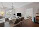Stylish living room featuring hardwood floors, a sofa, and an open doorway to the bedroom at 325 E Paces Ferry Ne Rd # 312, Atlanta, GA 30305