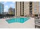 Outdoor pool with plenty of lounge chairs and a view of the building at 325 E Paces Ferry Ne Rd # 312, Atlanta, GA 30305