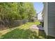 This is a backyard with a lawn, a wooden fence, and a small patio at 3571 Oakshire Se Way, Atlanta, GA 30354