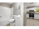 Bathroom with tub, shower and white vanity next to the kitchen at 3571 Oakshire Se Way, Atlanta, GA 30354