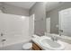 This is a bathroom with tile floors, a tub, a shower, and a vanity with a sink at 3571 Oakshire Se Way, Atlanta, GA 30354